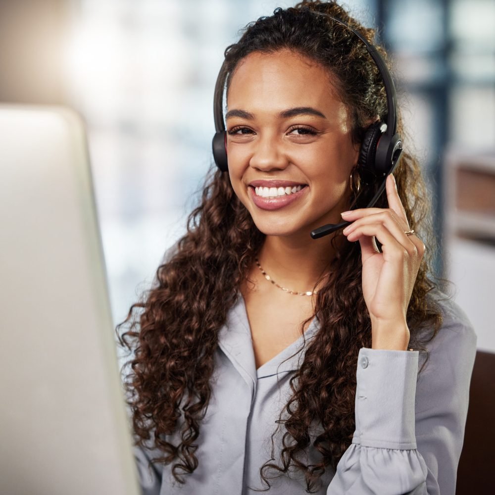 Ready to help and serve. Shot of a young businesswoman working in a  call center